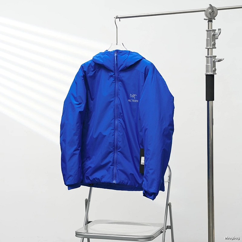 Arc'teryx Royal Blue Lightweight Shell Jacket with vivid hooded finish and compact outdoor profile