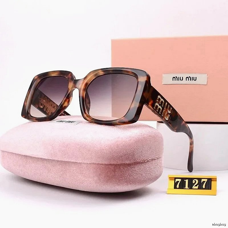 Miu Miu Relaxed Oversized sunglasses Black Oval Sunglasses with Designer-Inspired Detail